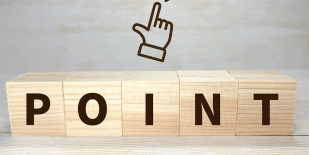 木製ブロックに「POINT」と書かれた上に指差しアイコンがある画像